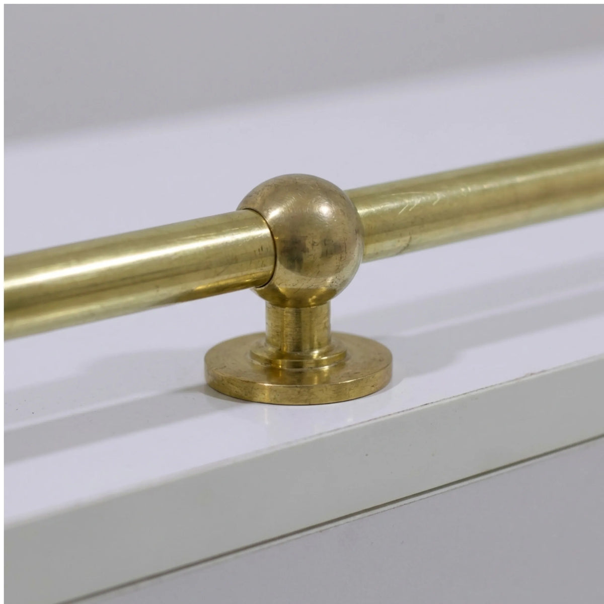 Gallery railing ball-joint post, close-up of solid brass detail – Brassdoria